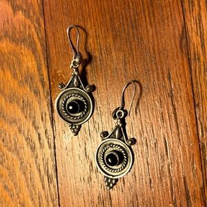Silver earrings with black bead in center
